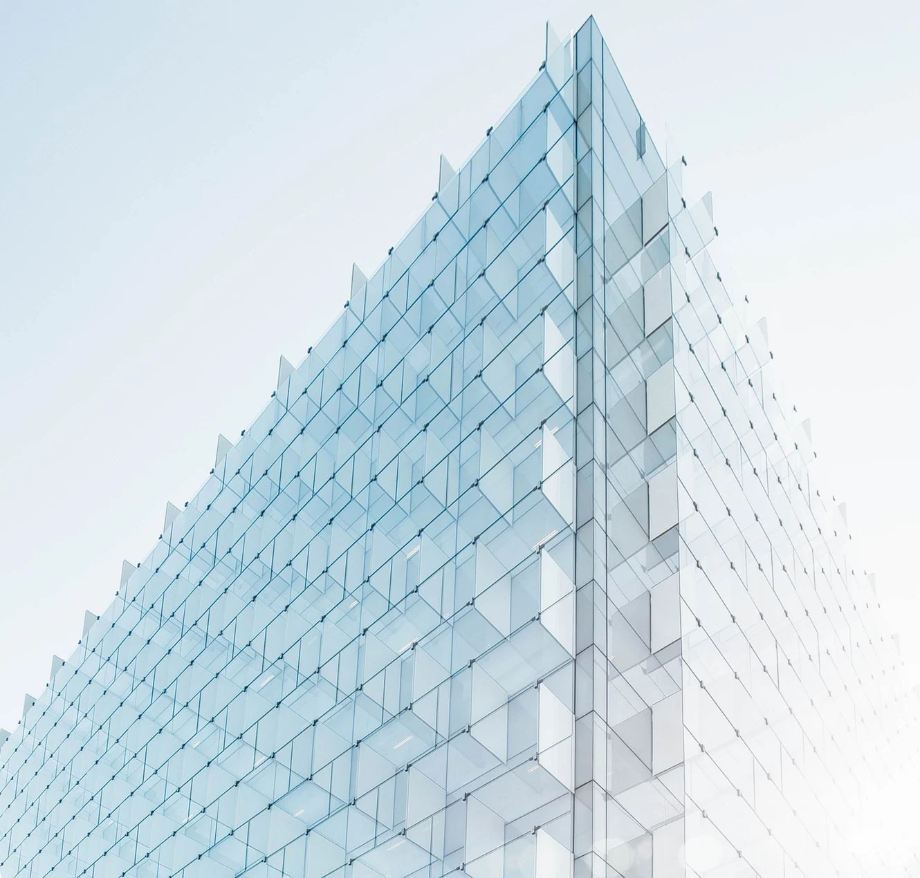 Minimal glass tower against clear sky